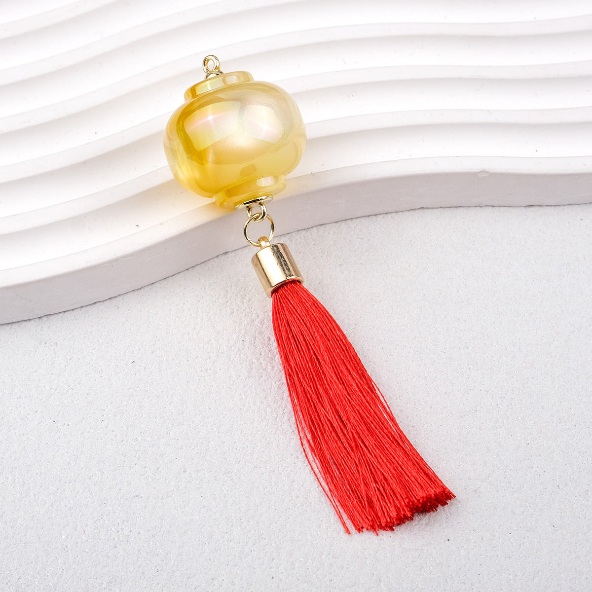 1.9再入荷【T115】提灯カン付きパーツ（キャッツアイ加工レジン、タッセル付き、57*53*25mm）